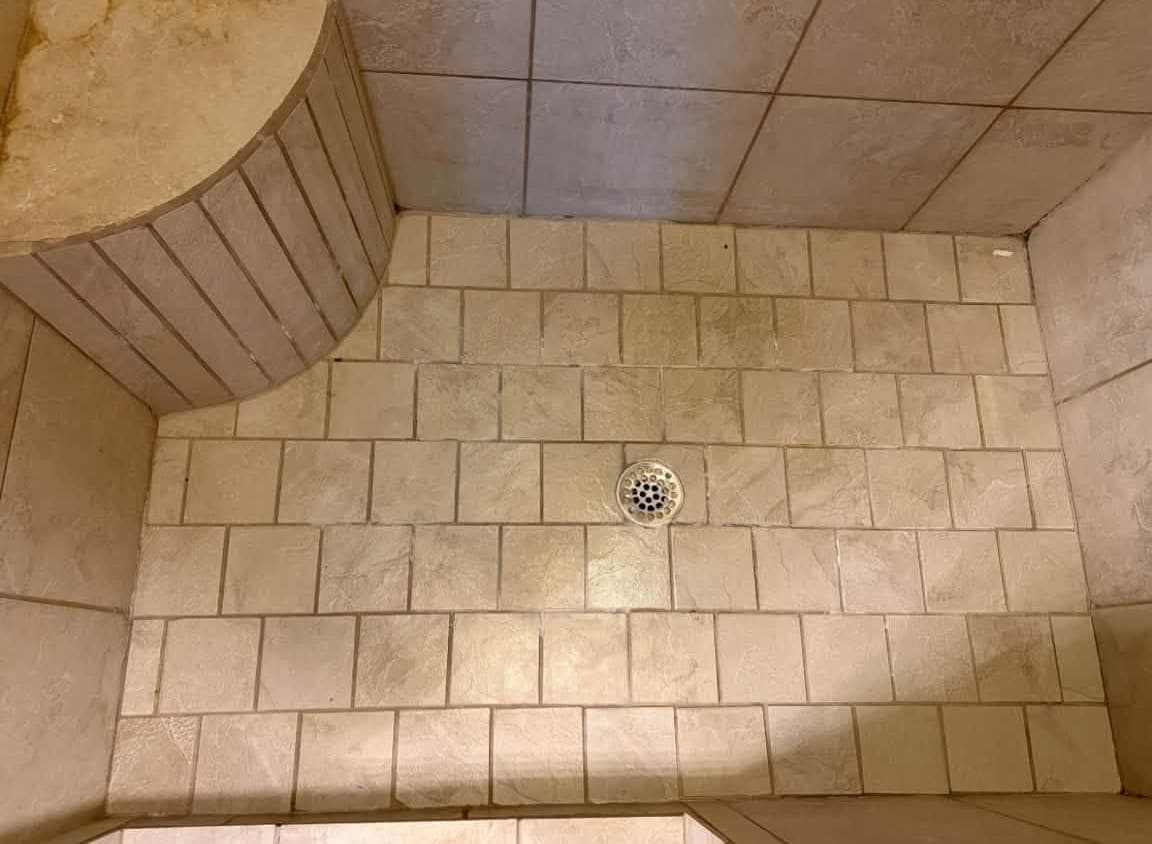 Shower floor tile and grout before a deep cleaning